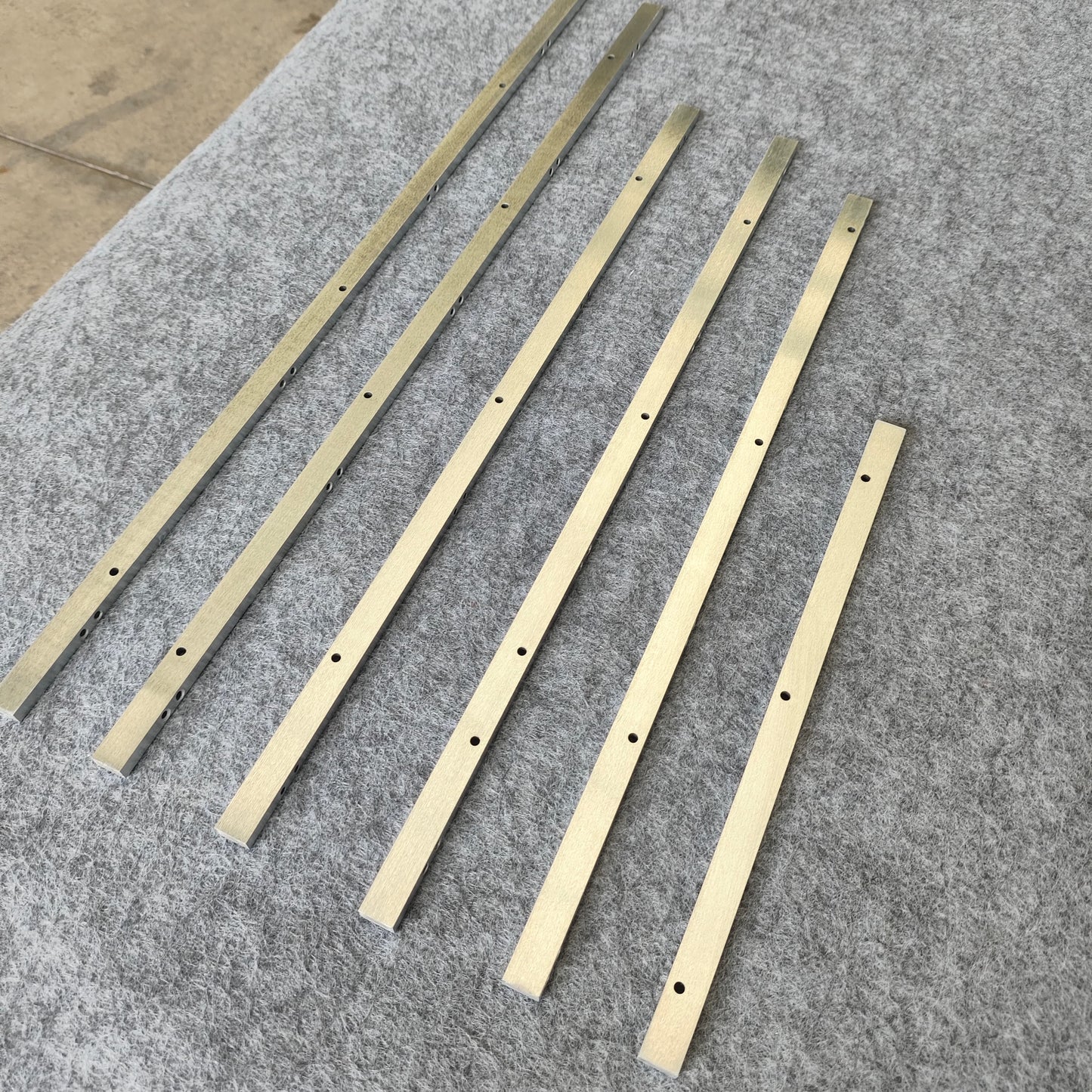 Chemical-resistant linear guides, circular guide conveyor lines, laboratory consumables assembly lines