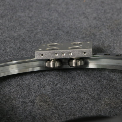 Detailed view of curved guide rail slider