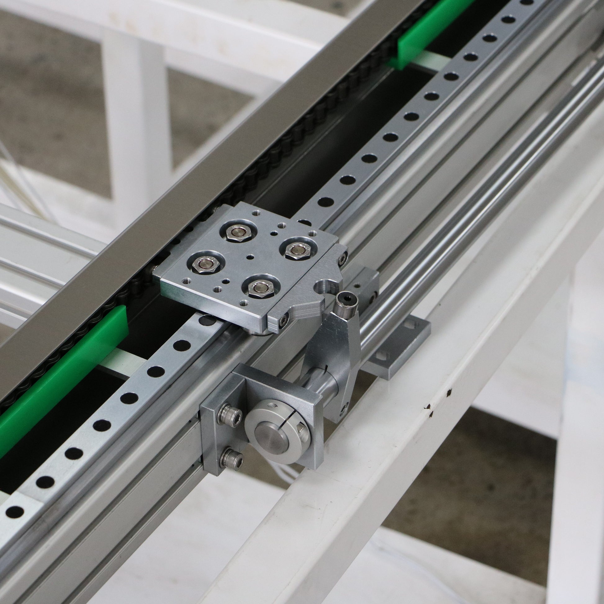 Detail of slider of chain drive track system