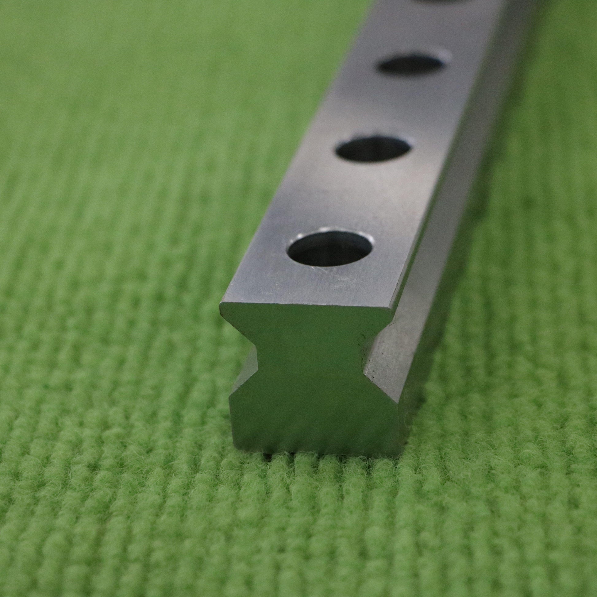 Detailed view of V-shaped linear guide