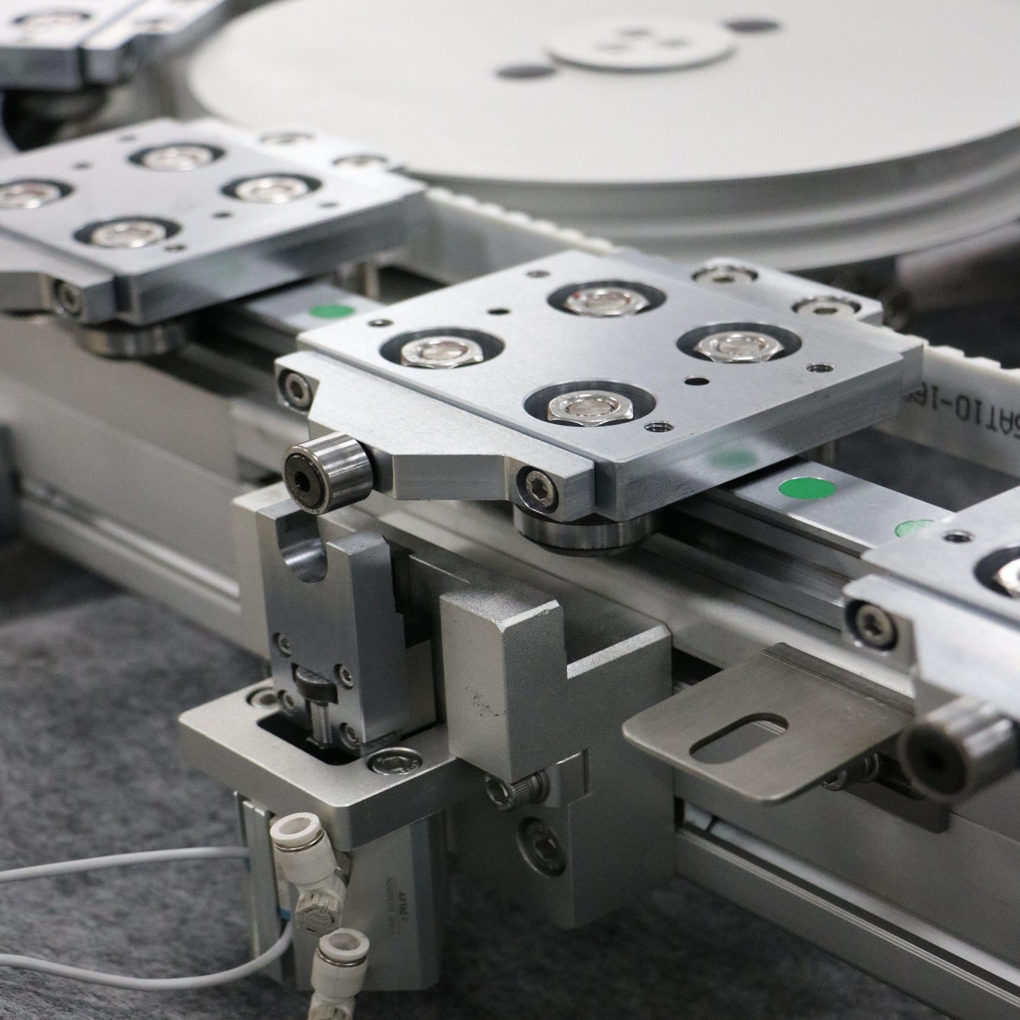 Detailed view of slider positioning for synchronous belt driven track system